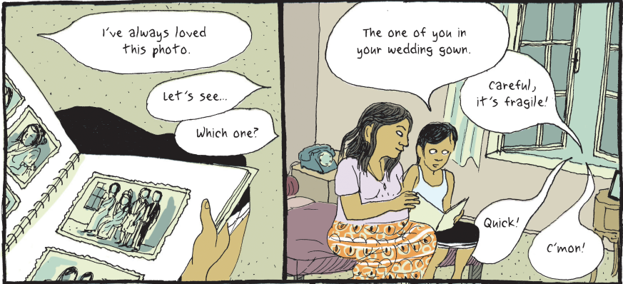 a mother and child look at a photo album